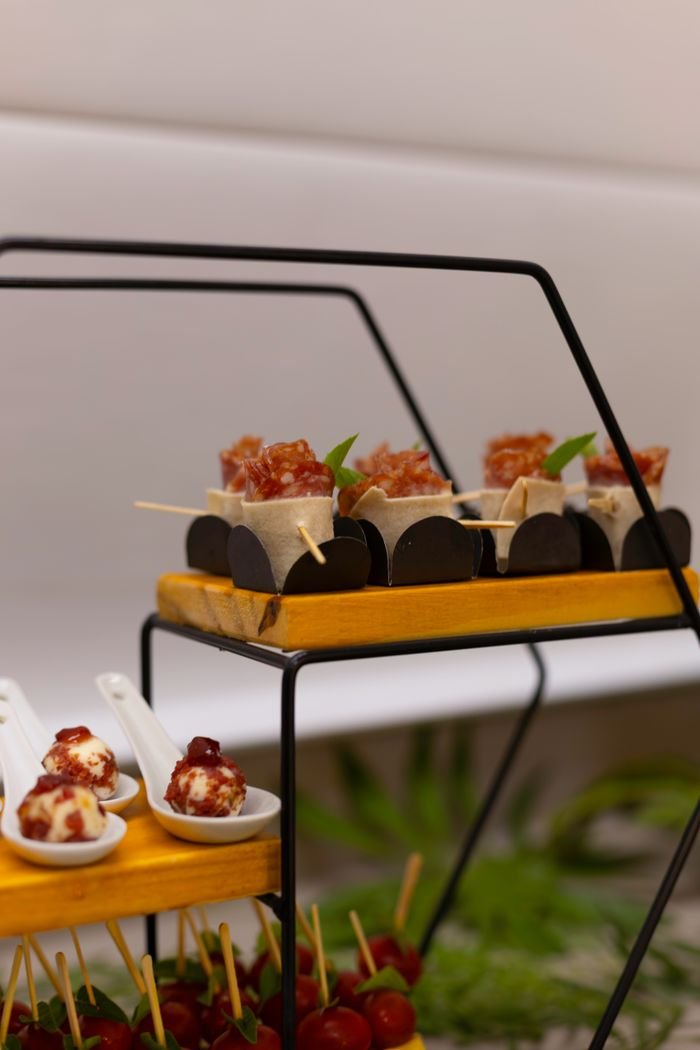 ours-journey A sophisticated arrangement of gourmet appetizers and canapés at a caterered event.