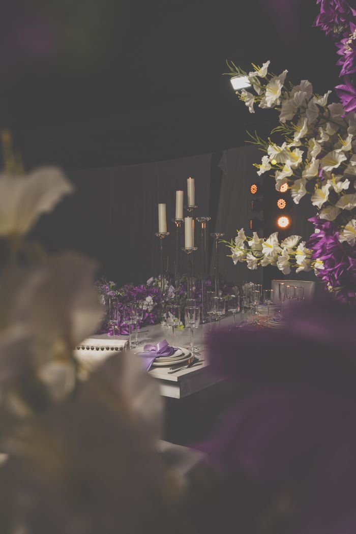 our-services-1 Luxurious dining setup with candles and floral decor, perfect for weddings and formal events.